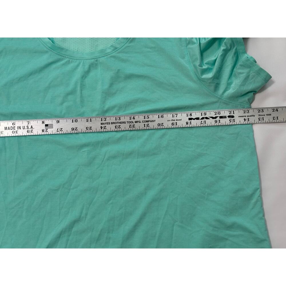 Kirkland women's mint green t-shirt good for yoga/athletics. Loose fit Size L/XL